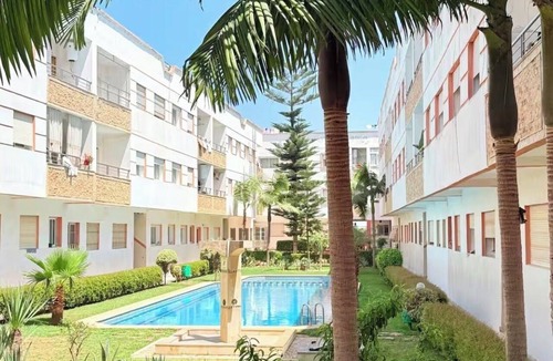 Harhoura Apartment | Bright apartment with a pool, 5-minute walk to the beach
