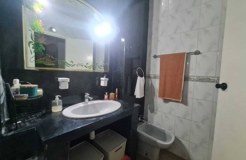 Sidi Bernoussi Bed & Breakfast | Cozy Villa bedroom with balcony : private bath accessed via shared space.