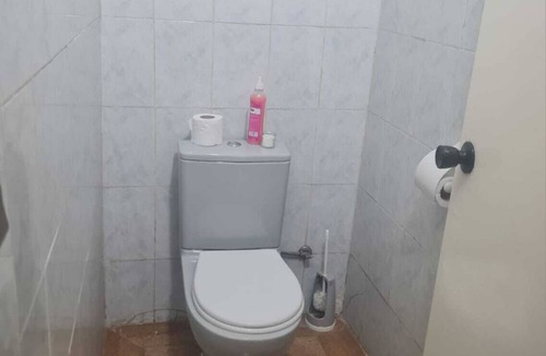 Sidi Bernoussi Bed & Breakfast | Cozy Villa bedroom with balcony : private bath accessed via shared space.