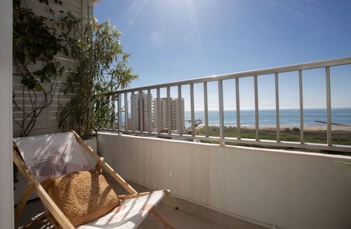 Playa Pobla de Farnals Apartment | Experience the ultimate summer escape in this exclusive designer retreat, meticulously crafted for those seeking to disconnect in total style by the sea. Available from June to September, this apartment stands out for its bright, avant-garde interior whe