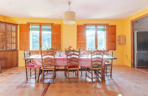 Hoz y Costean Cottage | Room with private bathroom and living room in a rural house