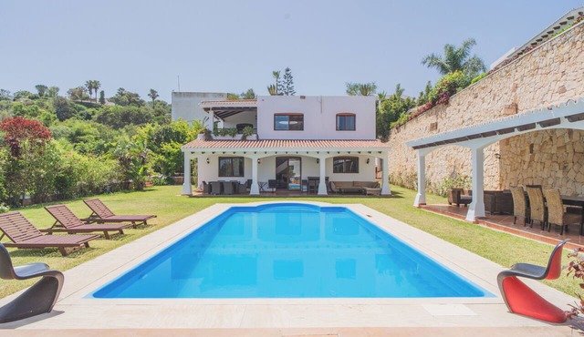 4-bedroom villa, private mountain setting with large garden, pool, and sea view.