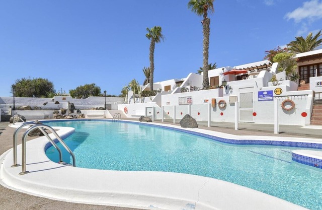 Apartment Puerto Chico 1 with Sea View, Garden and Shared Heated Pool in Yaiza