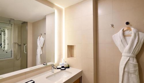 Guest Room with Two Double Beds and Pool View