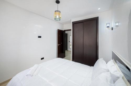 Cite Al Mohammadi Apartment | Bel appartement piscine,10 min souk, plage, bein sport